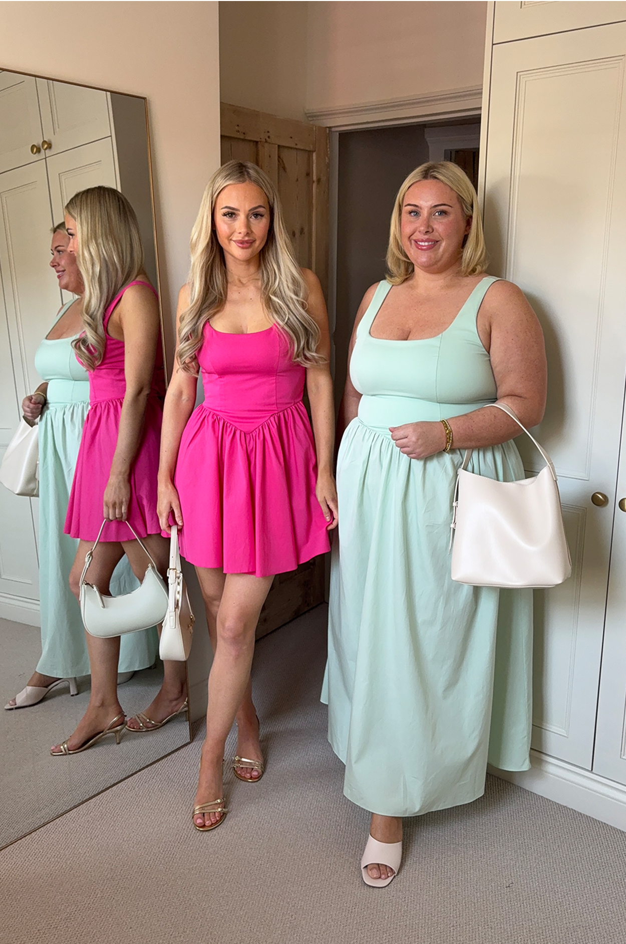Models in the pink bow mini dress and the green bow maxi dress with white bags and sandals