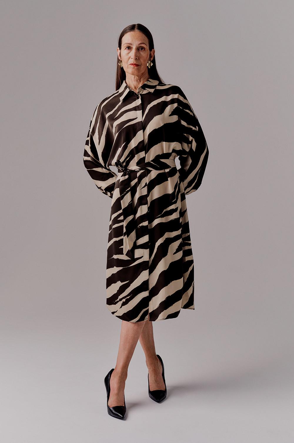 Model wears Zebra print dress