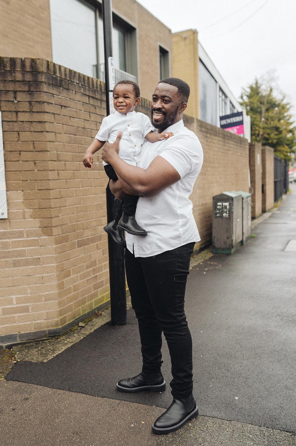 Male models wearing tailored white shirts and black pants.