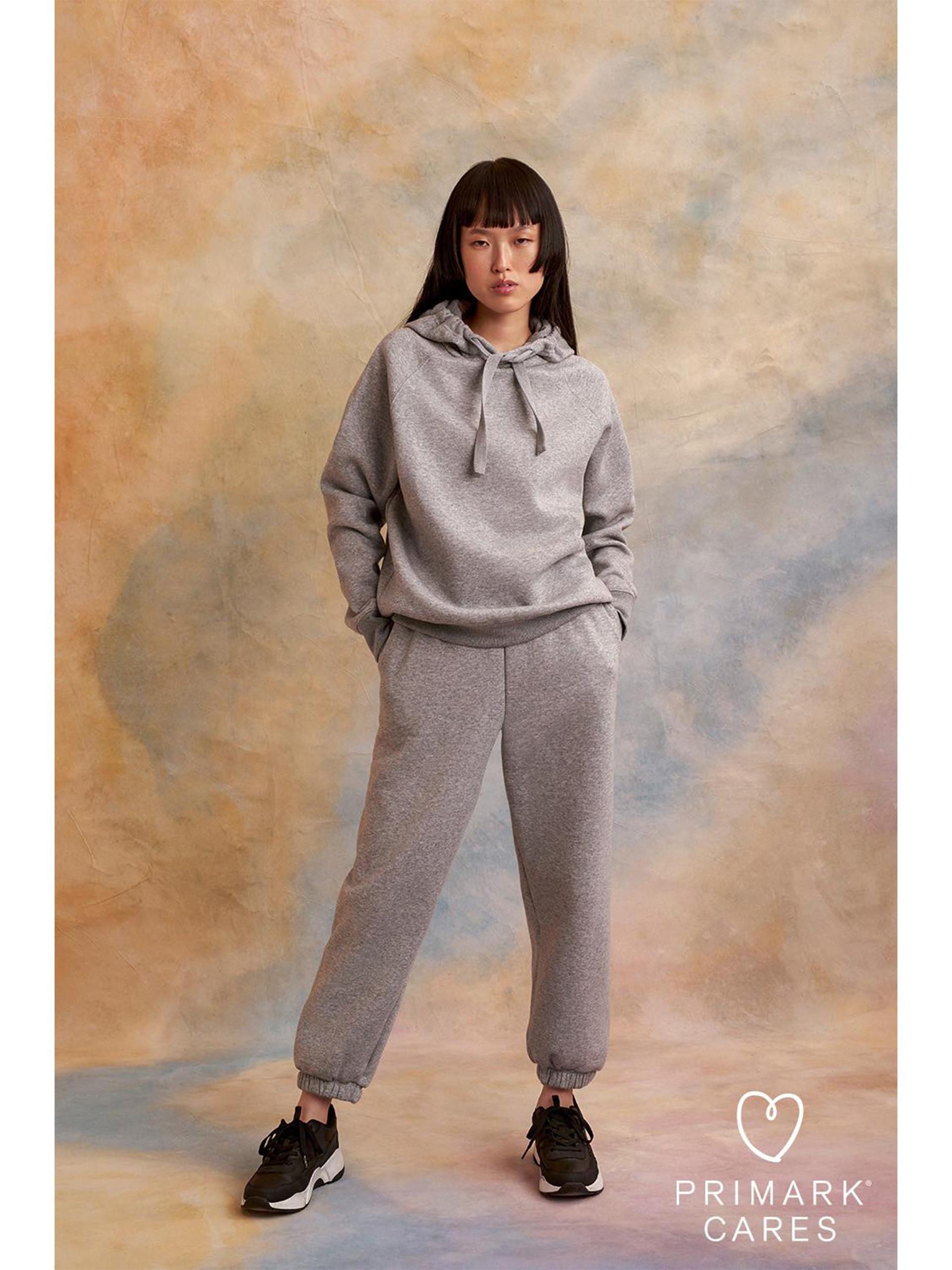 woman wearing grey tracksuit