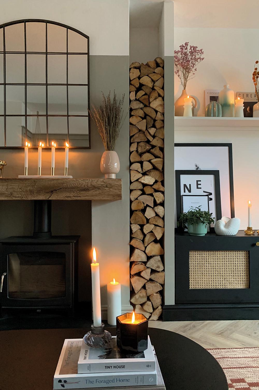 Fireplace with candles, mirror and vases