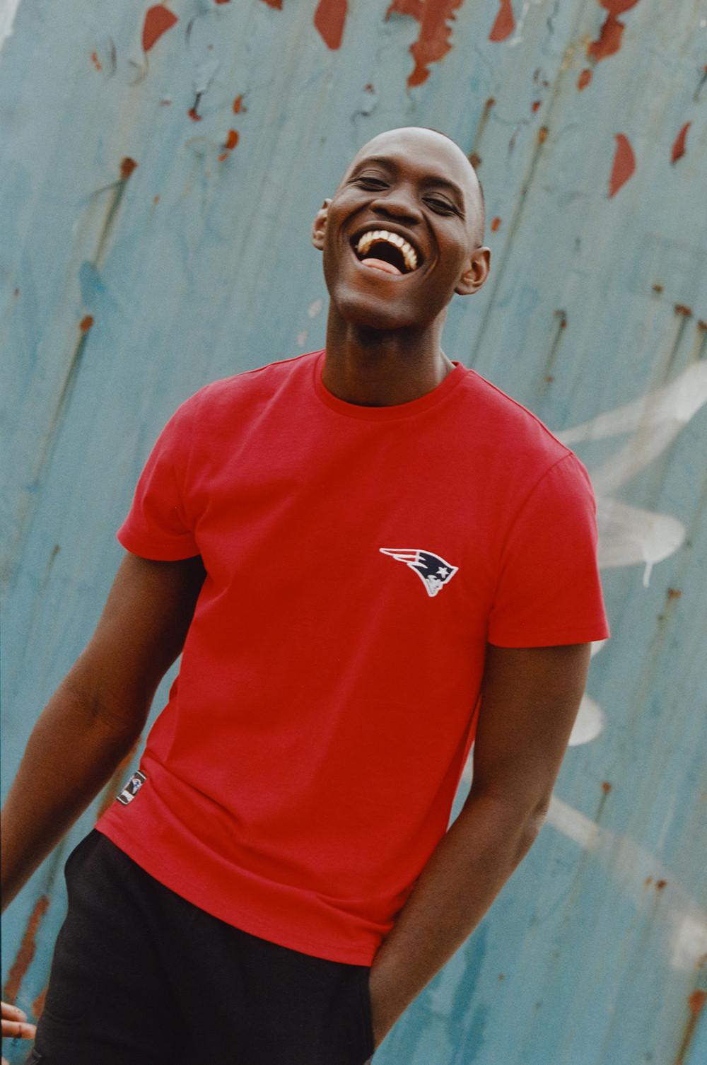 Model wears red NFL Tshirt