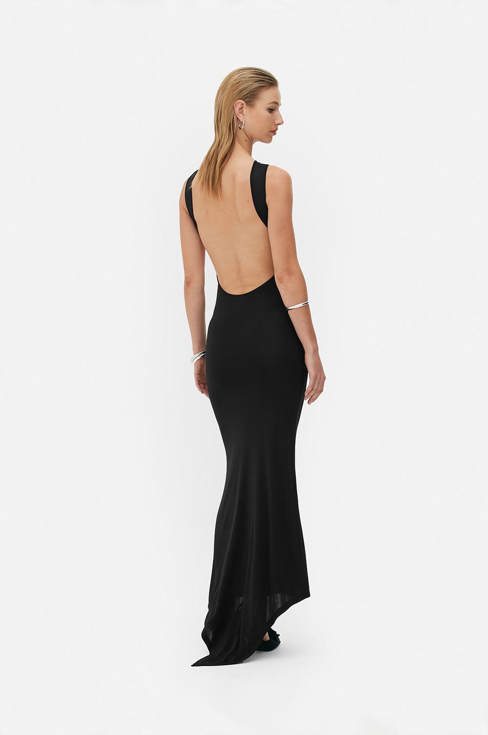 Model wears black backless dress