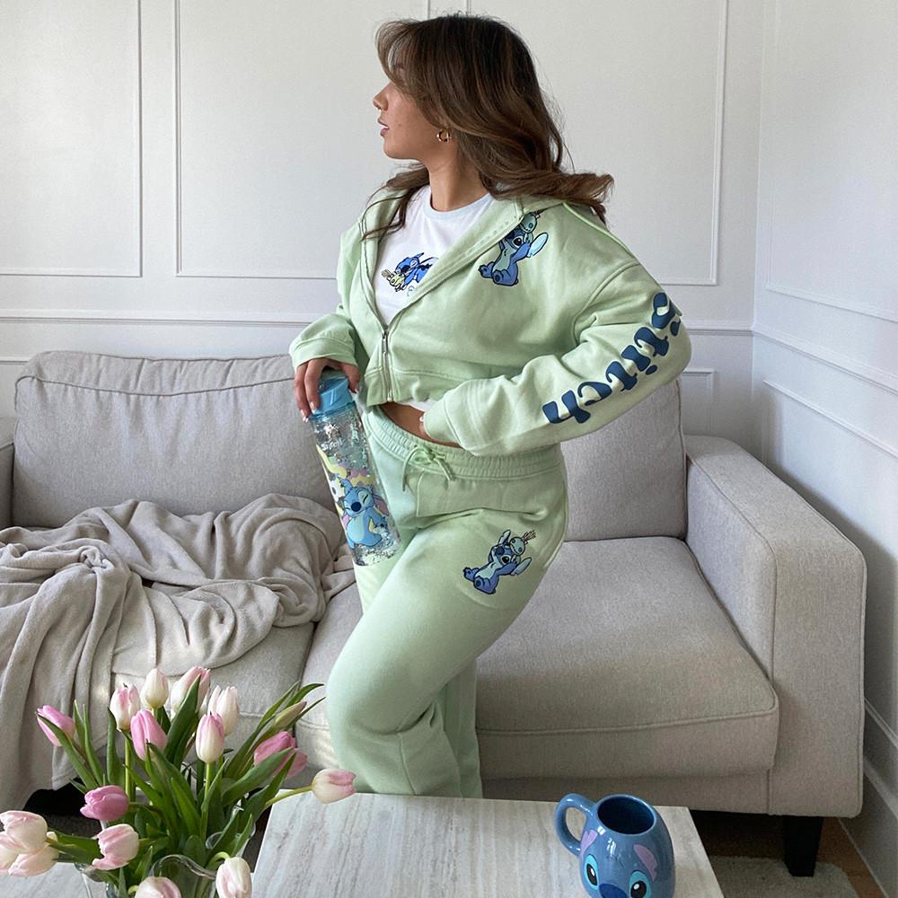 Model wears green stitch tracksuit