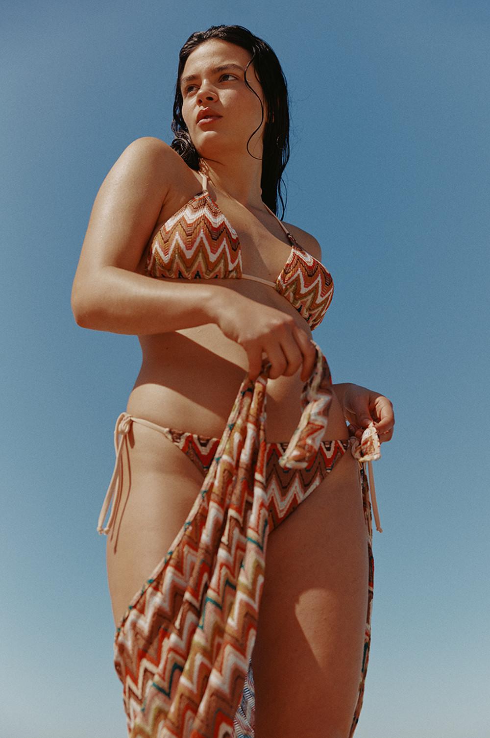 Model wears printed bikini