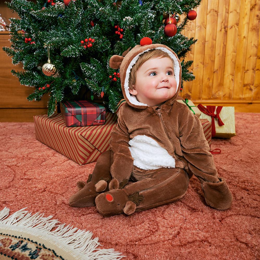 Baby wears reindeer onesie