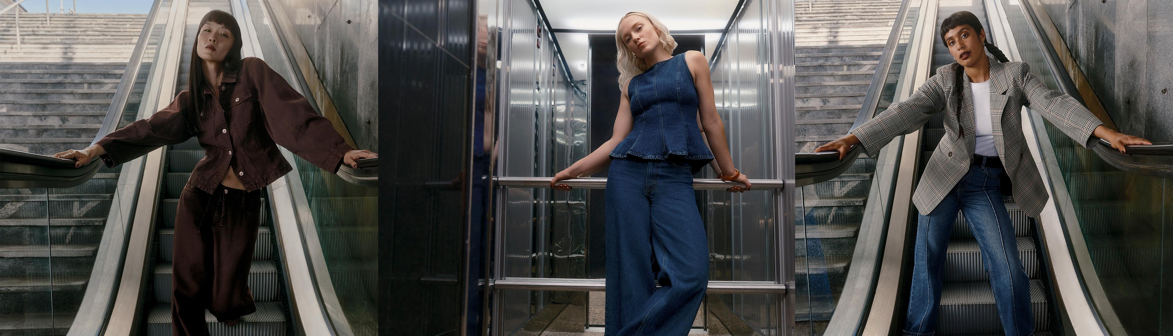 Tres modelos en escaleras mecánicas con distintos conjuntos: una de ellas con una chaqueta marrón, otra con un conjunto de prendas vaqueras y la otra con una americana a cuadros y unos vaqueros.