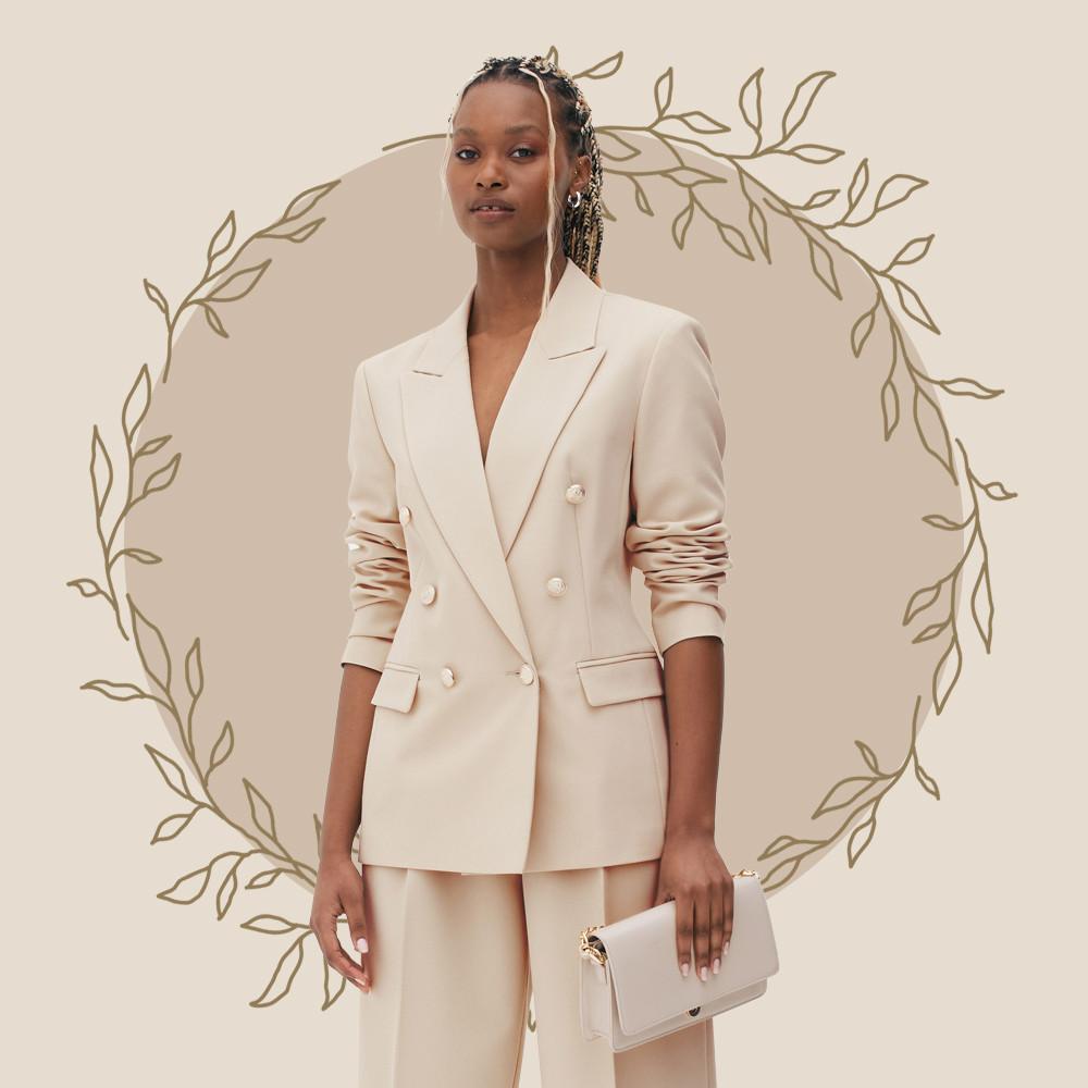 Model wears cream blazer and matching pants