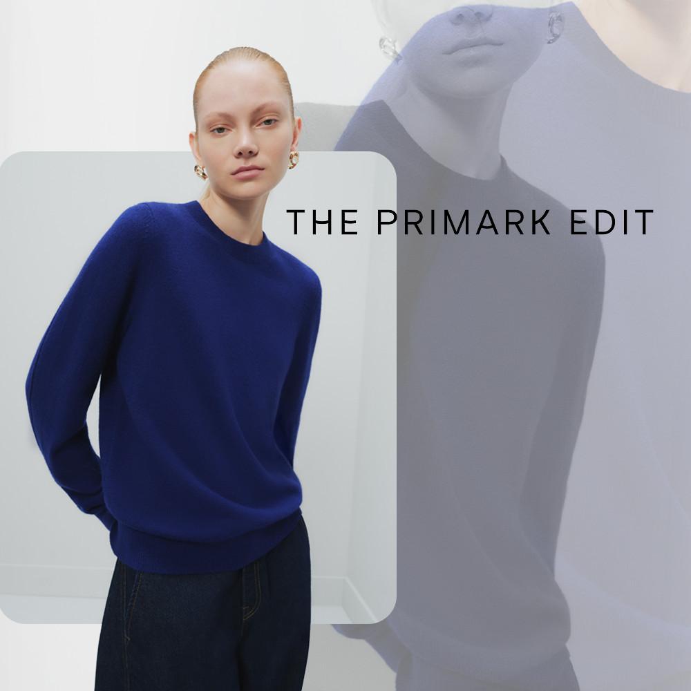 Model wearing a cobalt blue crew neck jumper with gold earrings from THE PRIMARK EDIT collection.