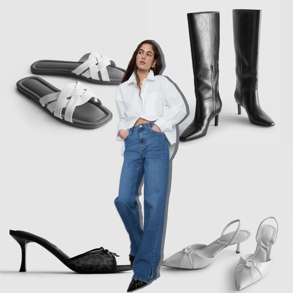 Person in white shirt and jeans surrounded by footwear collection including black boots, white sandals and elegant heels.