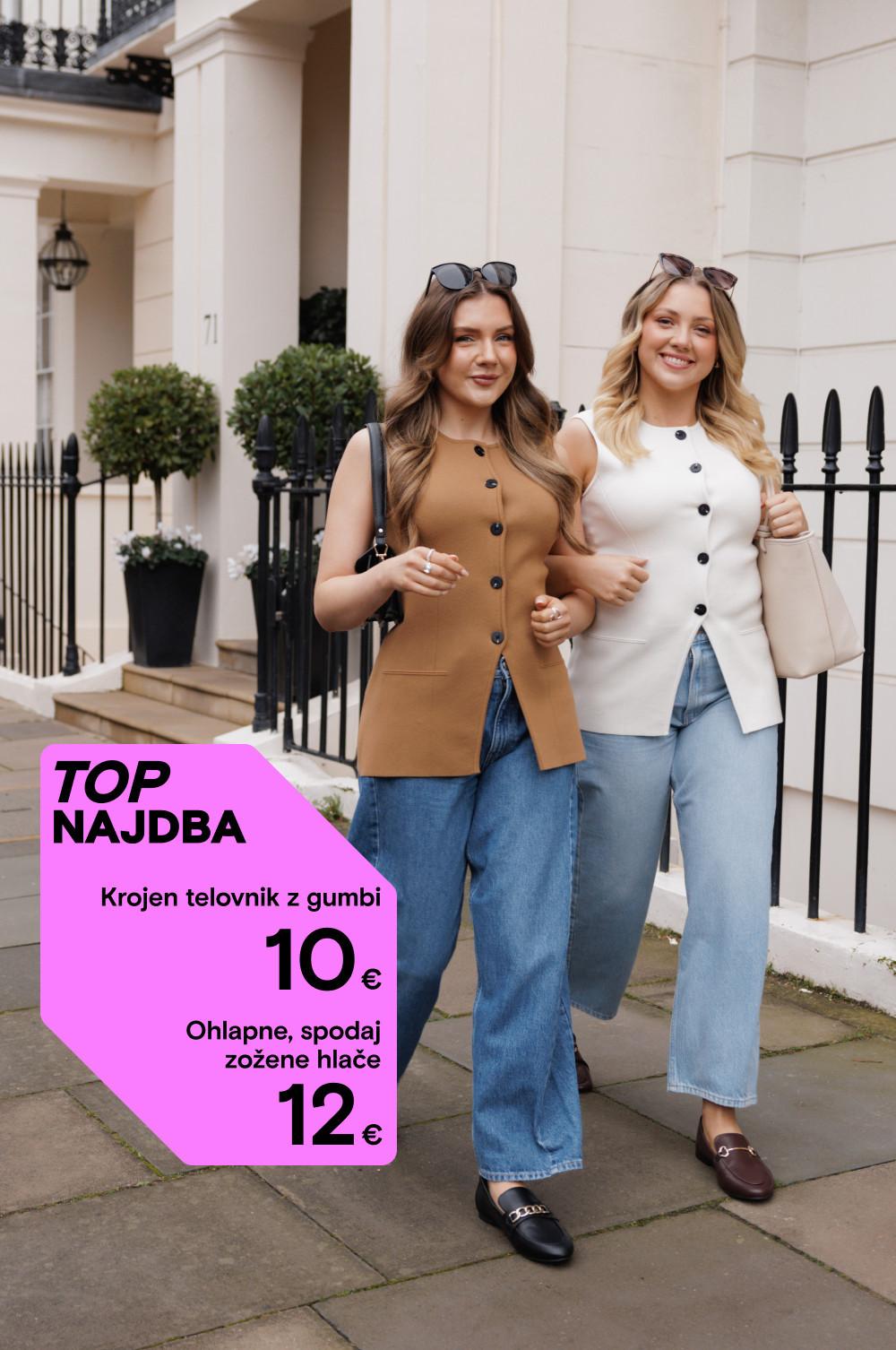 Dve ženski, oblečeni v telovnika kamelje in bele barve z gumbi ter modre kavbojke, pred elegantno stavbo. Prikazana je cena 10–12 €.