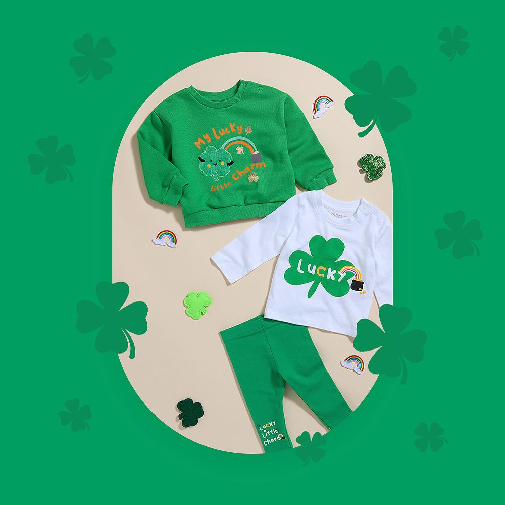 St Patrick's Day children's outfit set with green sweatshirt, white T-shirt and green joggers featuring shamrock designs.
