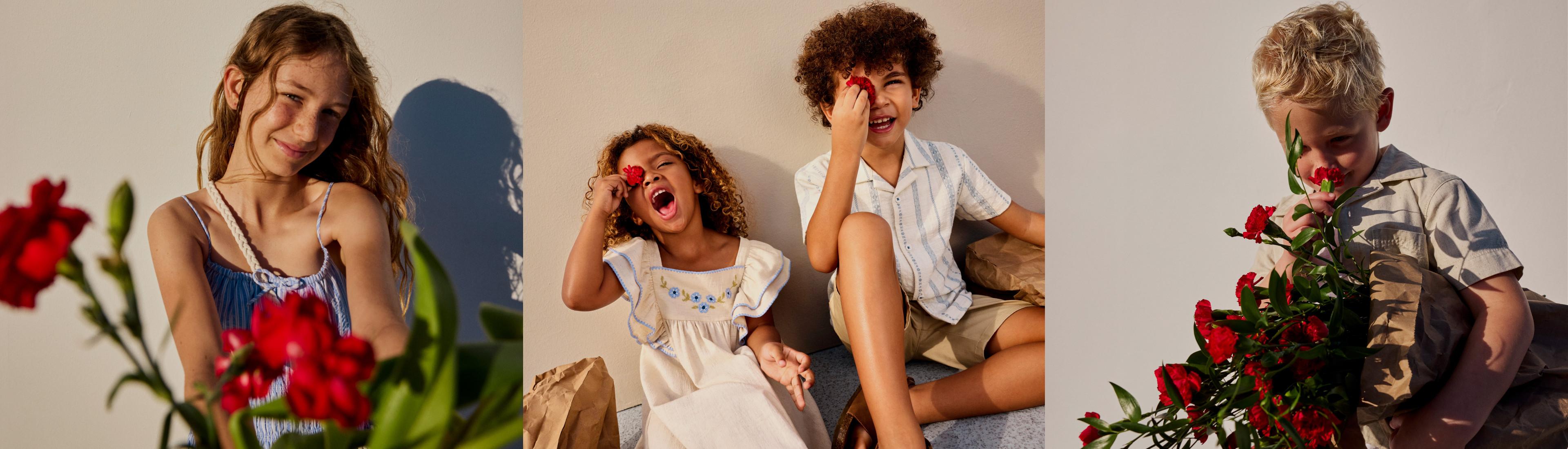 Enfants portant des vêtements d’été qui jouent avec des fleurs rouges, montrant une collection de tenues décontractées.