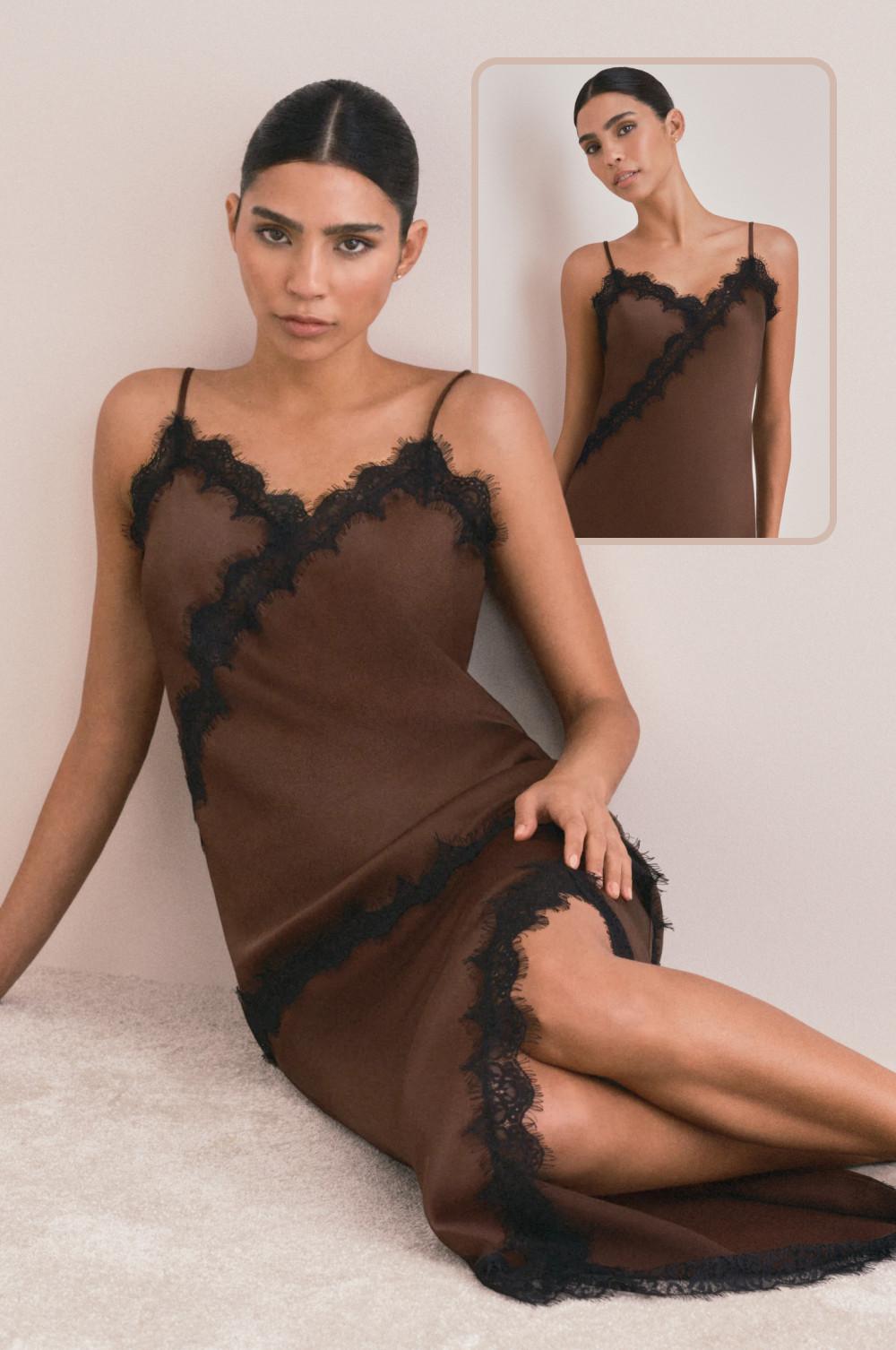Model wearing brown slip dress with black lace trim detail sitting on floor with inset showing full length.