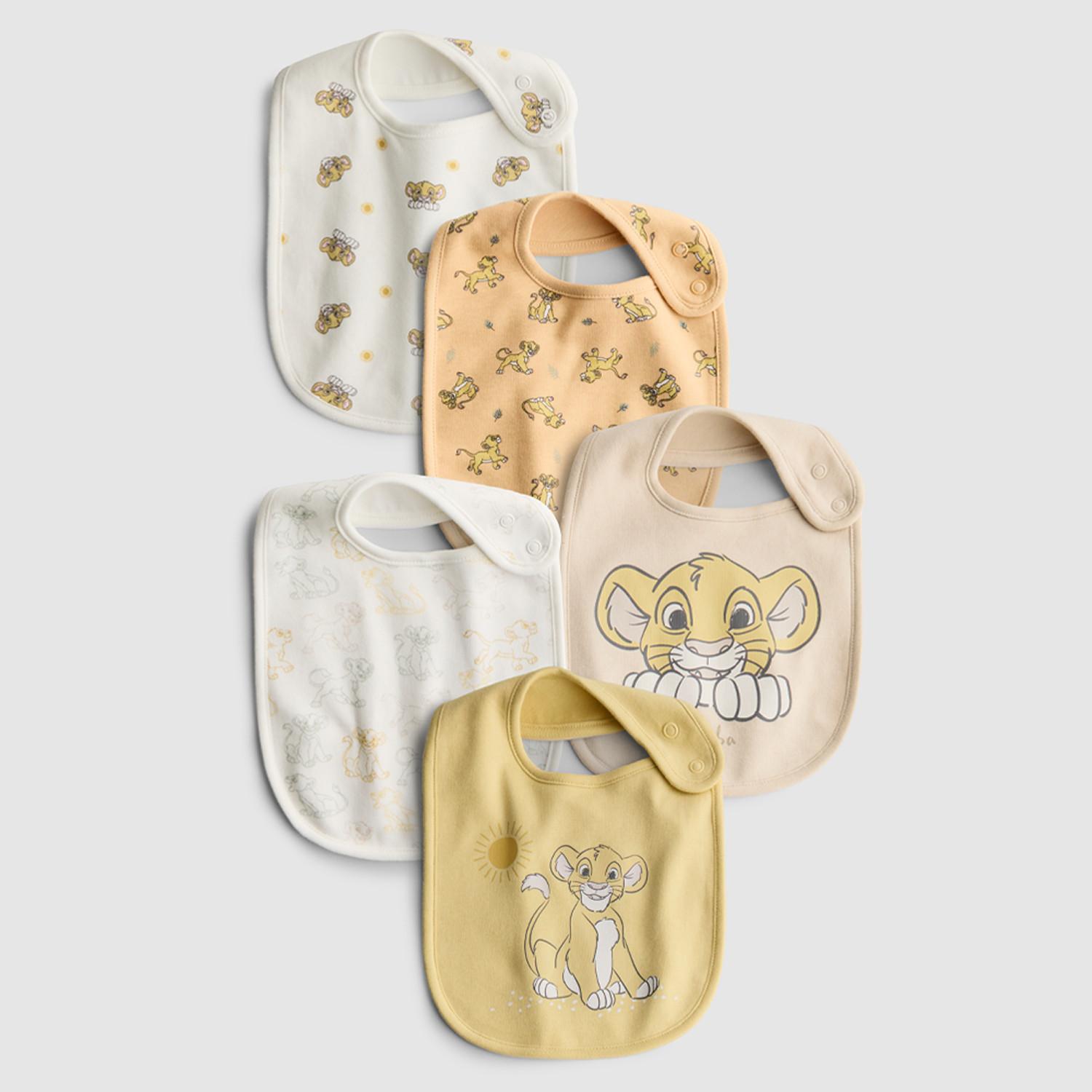 Five baby bibs featuring The Lion King Simba character in cream, peach, and yellow colourways.