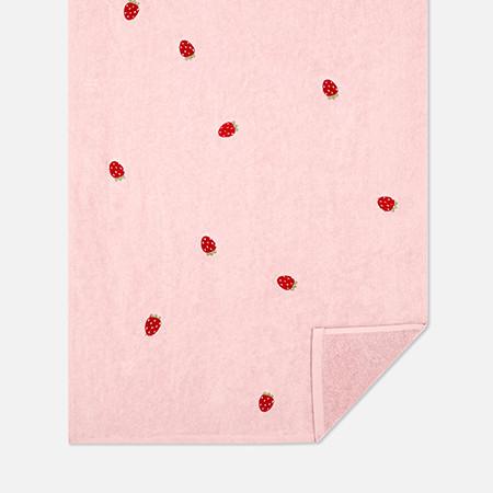 Pink towel with strawberry print