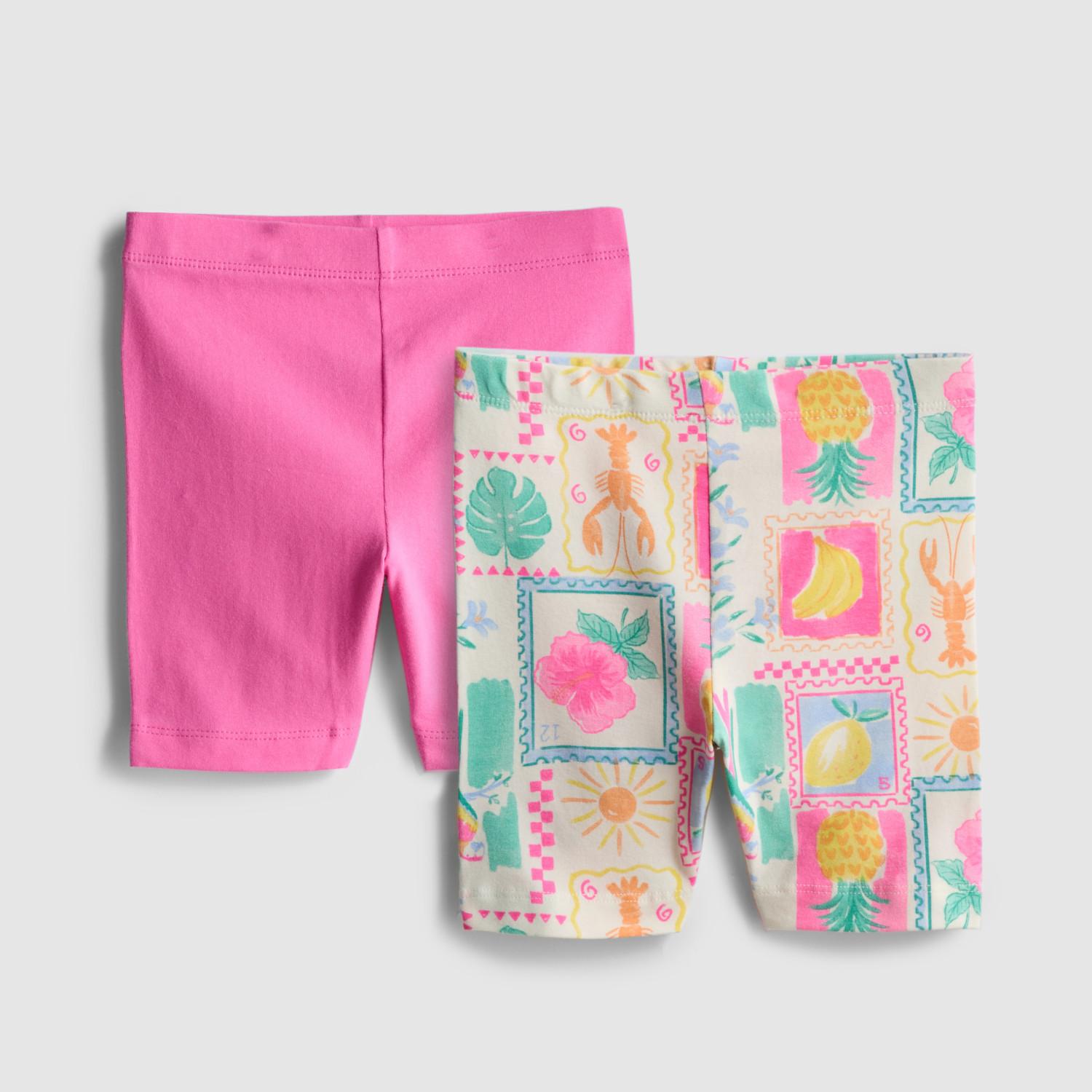 Two ribbed cycling shorts in peach and bright pink with elasticated waistbands.