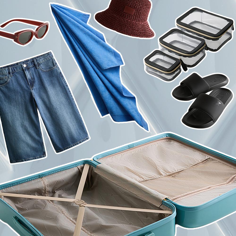 Open turquoise suitcase with summer vacation essentials including sunglasses, towel, hat, shorts and slides.