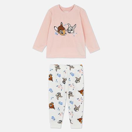 Children's pink pyjama set with Bambi and Thumper on the top and matching cartoon animal pattern on bottoms.