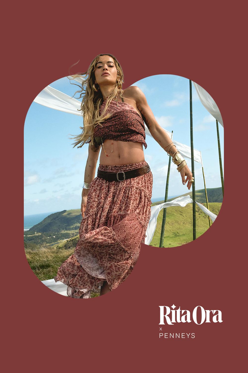 Rita Ora wearing a bandeau top and maxi skirt with eyelet belt