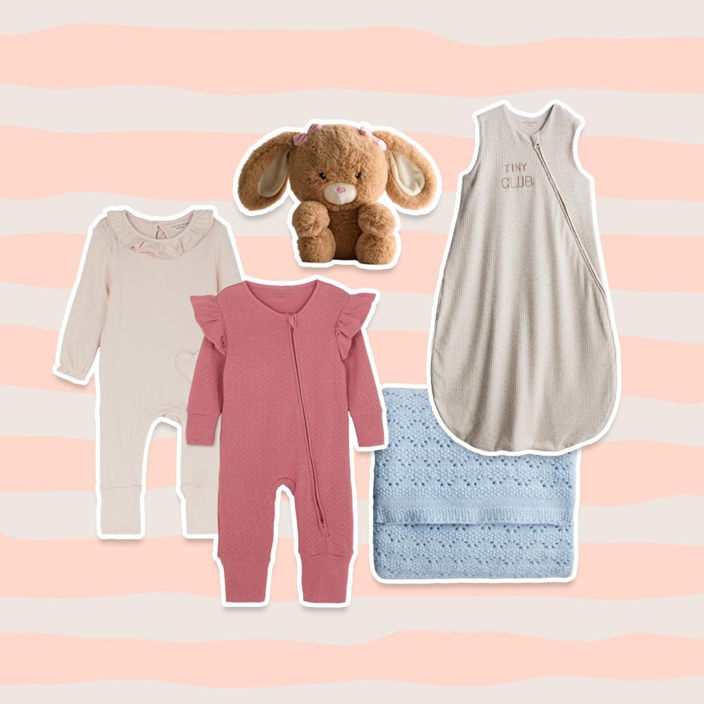 Collection of baby clothes including pink romper with cherry design, Stitch sleep sack, white onesie, pink blanket, and Minnie Mouse toy rattle.
