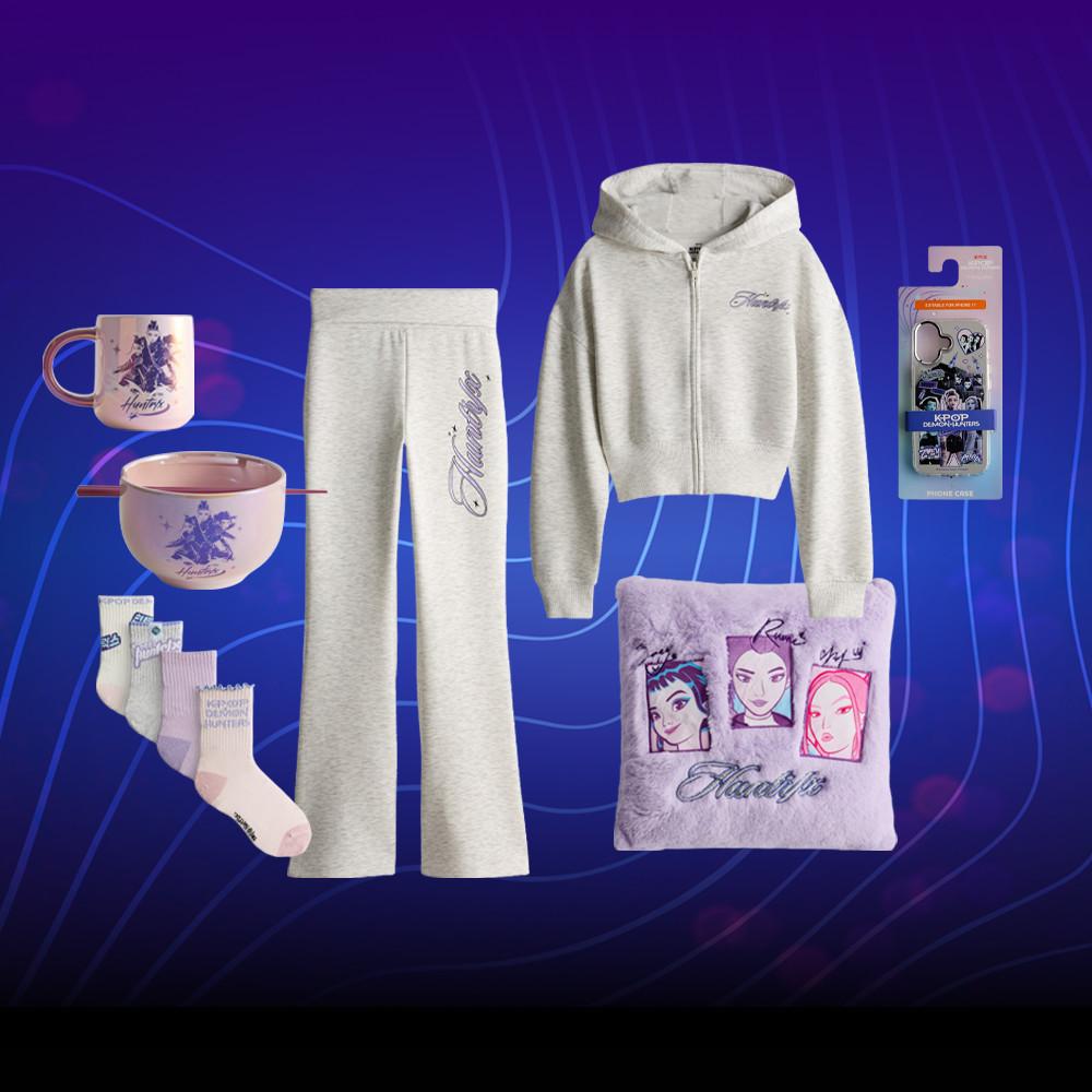 Gray tracksuit set with matching accessories including mug, bowl, socks, fluffy bag and phone case.