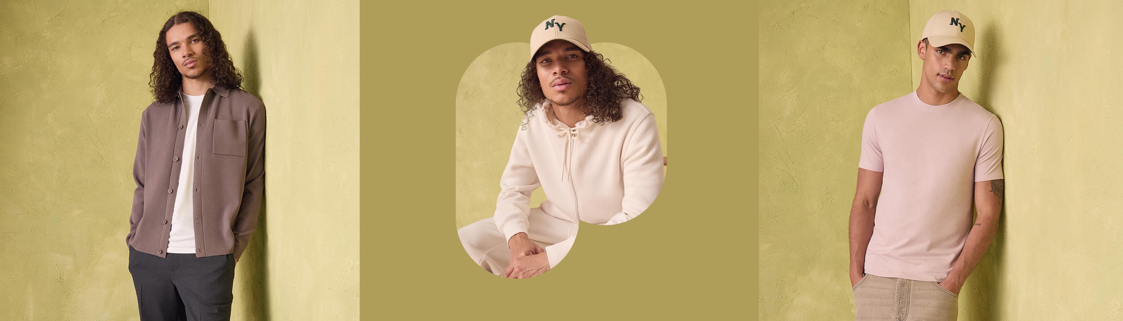 Three models displaying menswear collection against a green background featuring brown shirt, cream hoodie with NY cap, and pink T-shirt.