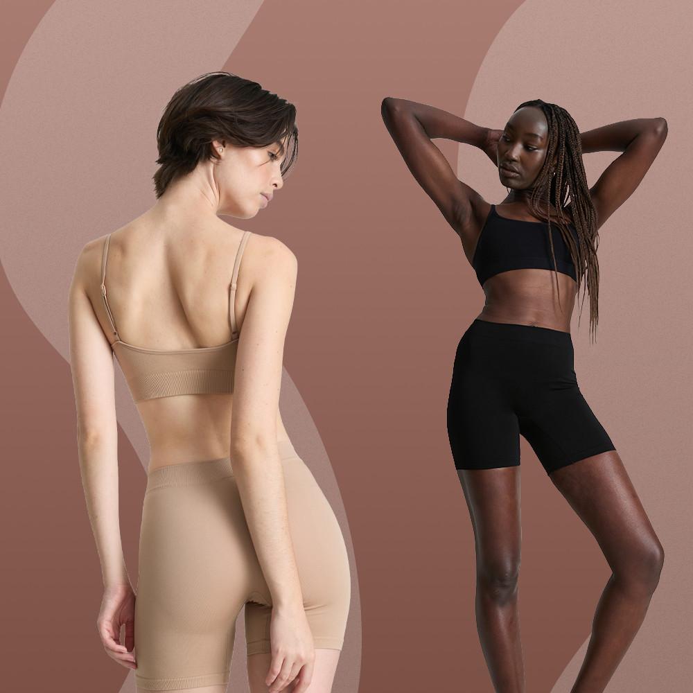 Two models wearing sports bras and cycling shorts in nude and black colorways.