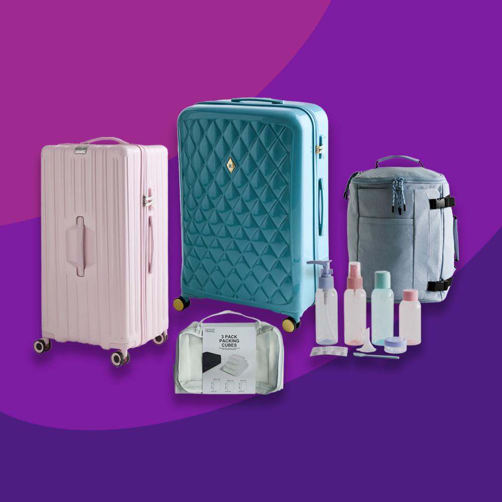 Travel luggage set including pink and teal suitcases, gray bag, packing cubes and travel bottles.