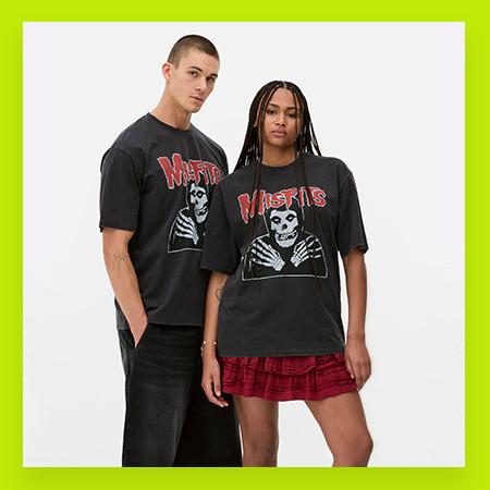 2 models wearing black Misfits band tees, styled with black trousers and a red skirt