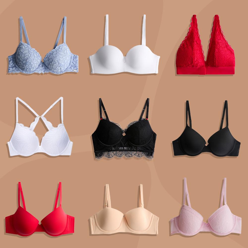 Collection of nine bras in various colors including blue lace, white, red, black, nude and pink.