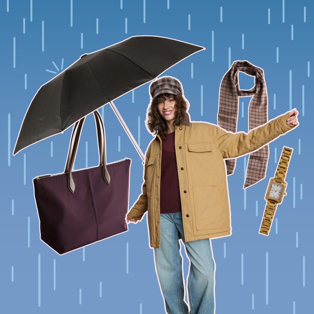 Model in yellow jacket and checked cap smiling, surrounded by umbrella, burgundy tote bag, scarf and gold watch.
