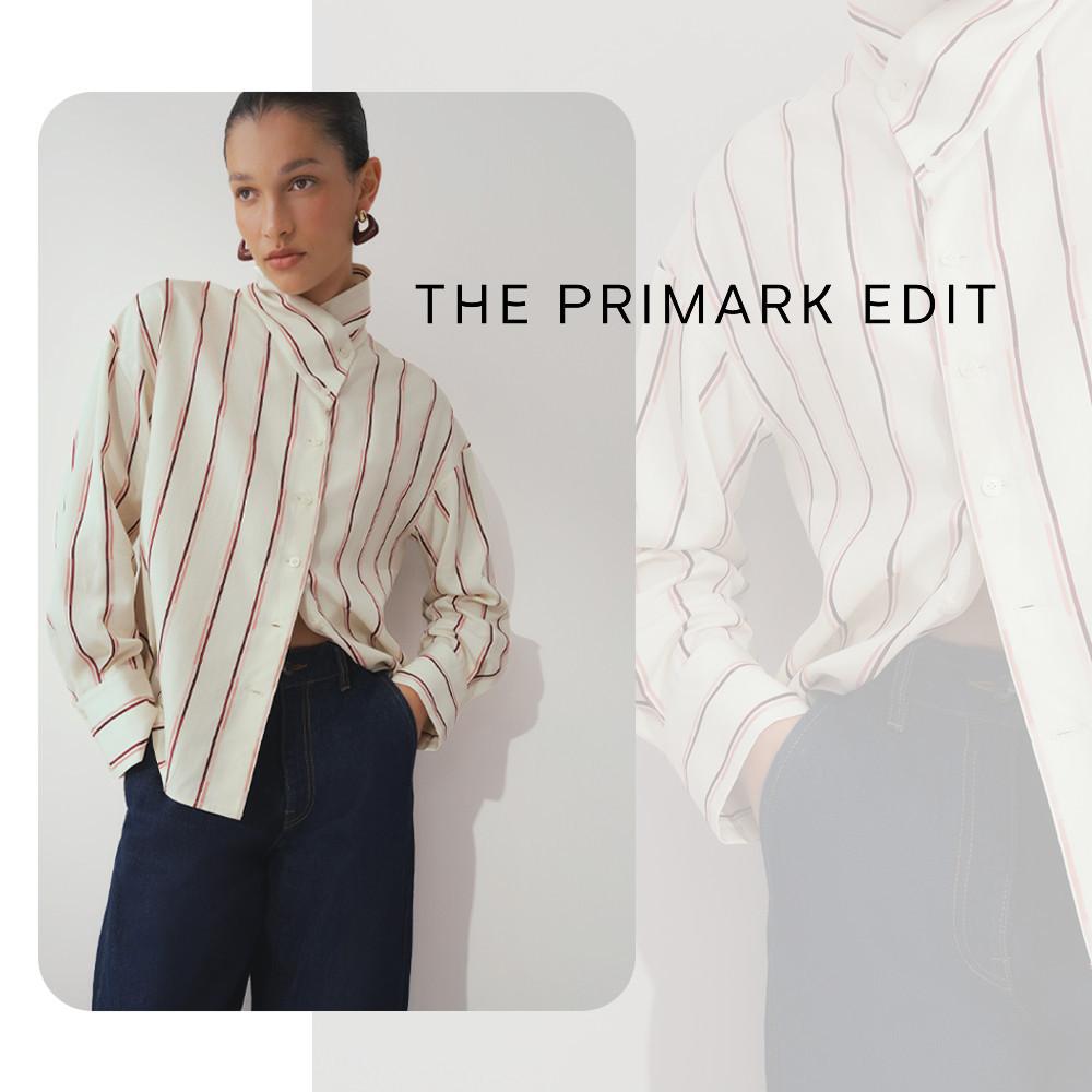 Model wearing a cream striped oversized shirt with dark denim jeans from THE PRIMARK EDIT collection.