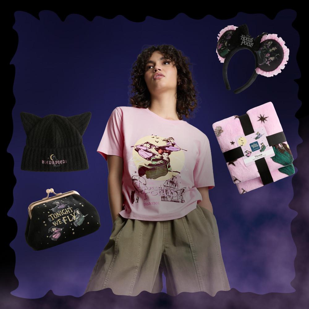Model wearing pink Hocus Pocus T-shirt with matching accessories including cat ear headband and purse.