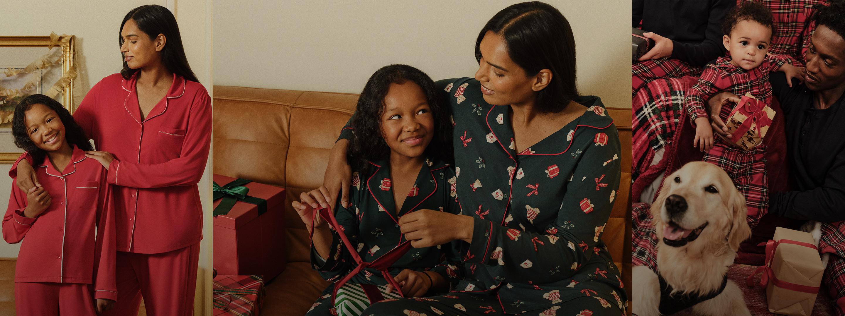 Family wearing matching festive pyjamas relaxing together at home with their golden Labrador.