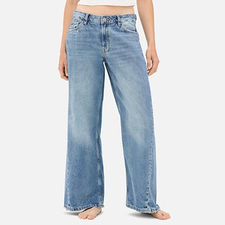 Burgundy wide leg track pants with white stripe detail along the sides featuring an elastic waistband.