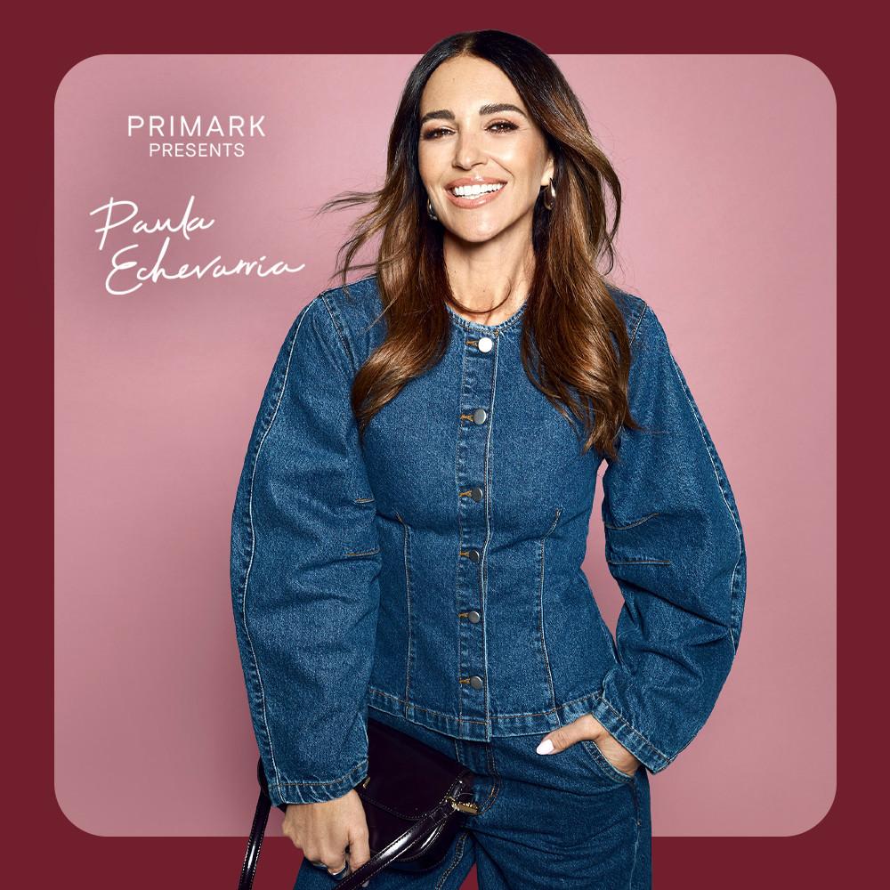 Woman smiling wearing a blue denim cinched top from the Primark Presents Paula Echevarria collection.