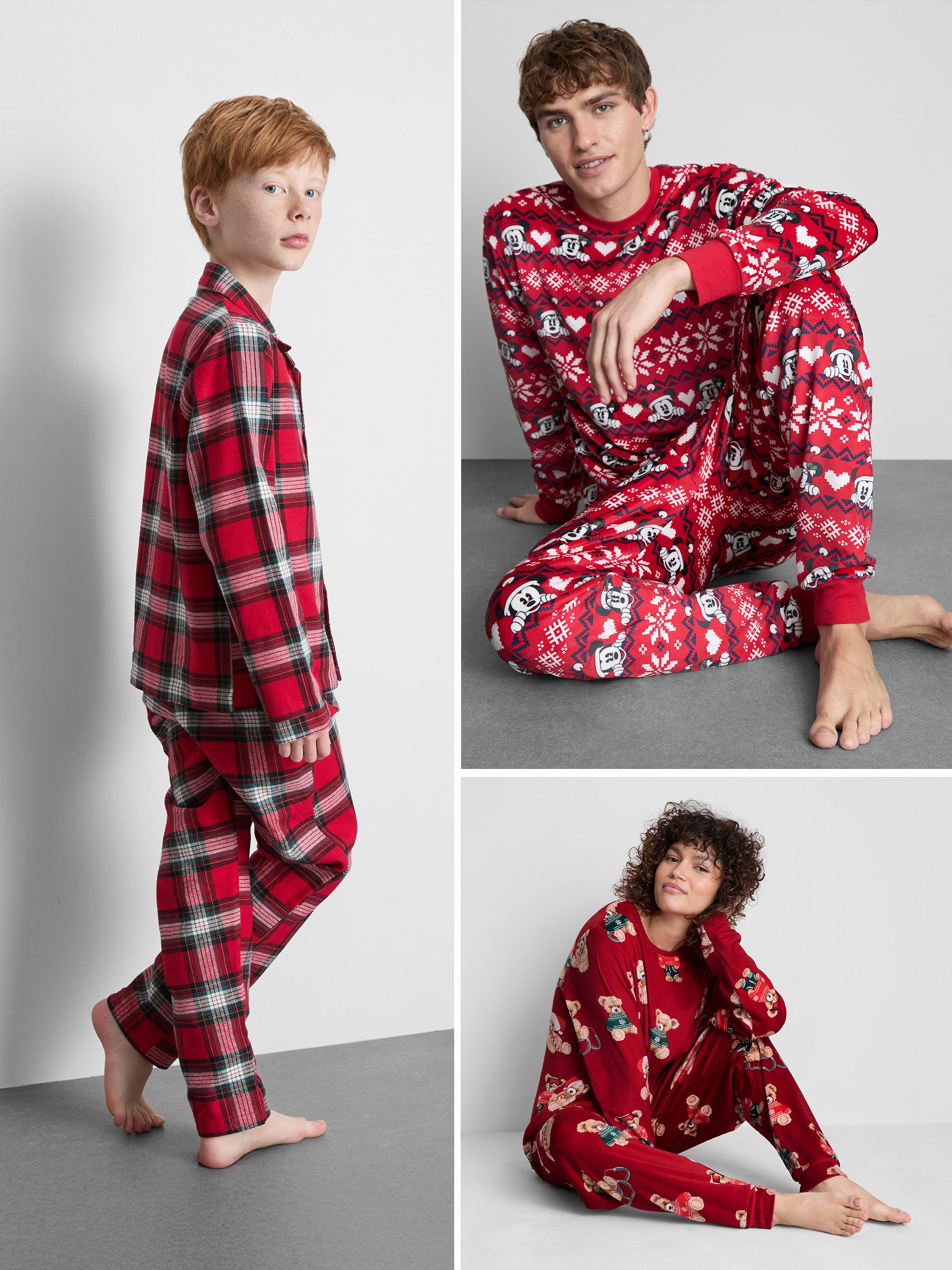 Three festive pyjama sets featuring red plaid, Mickey Mouse pattern, and teddy bear print designs.