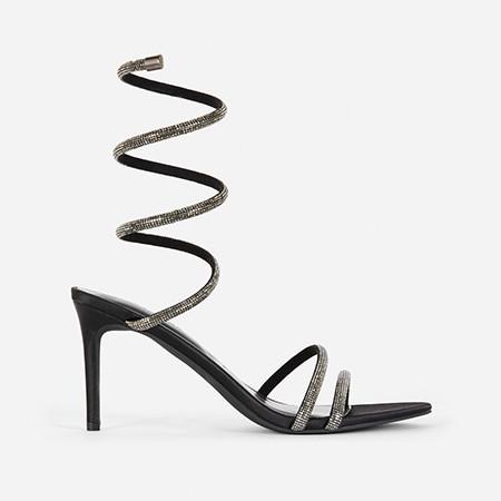 Black stiletto sandal with spiral rhinestone ankle strap wrapping up the leg.