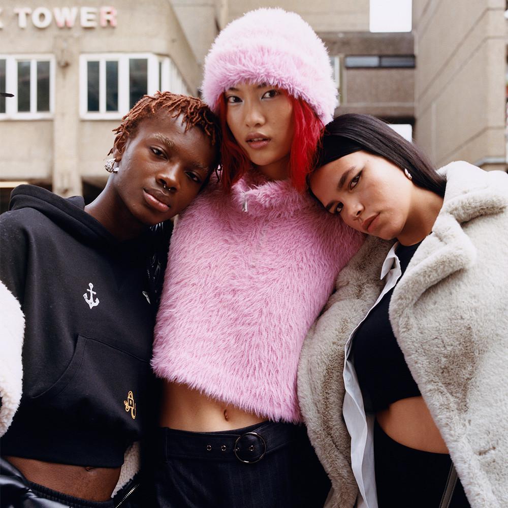Models in pink fluffy hat and sweater