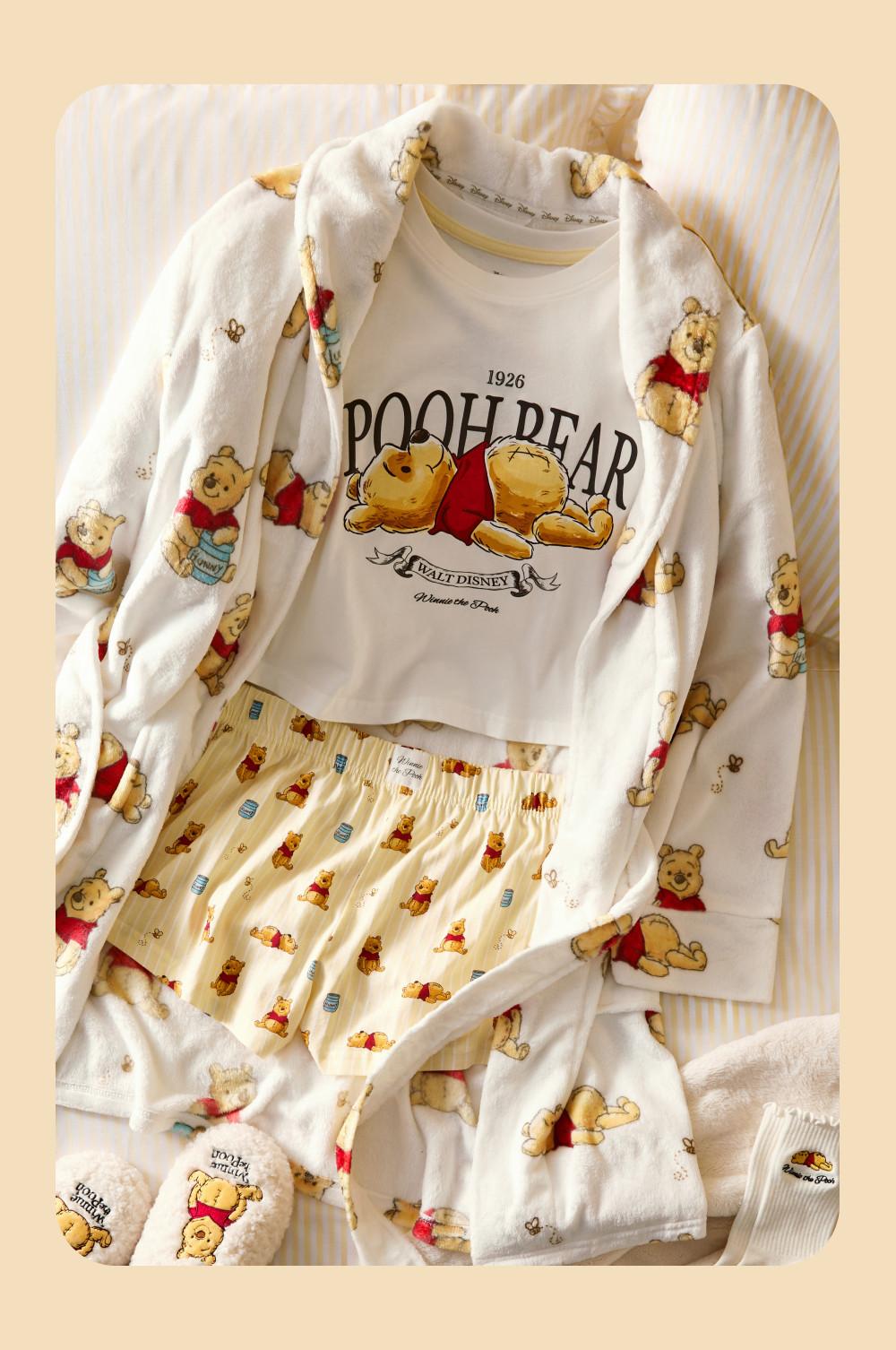 Disney Winnie the Pooh pyjama set featuring t-shirt, shorts, robe and slippers with matching character print.