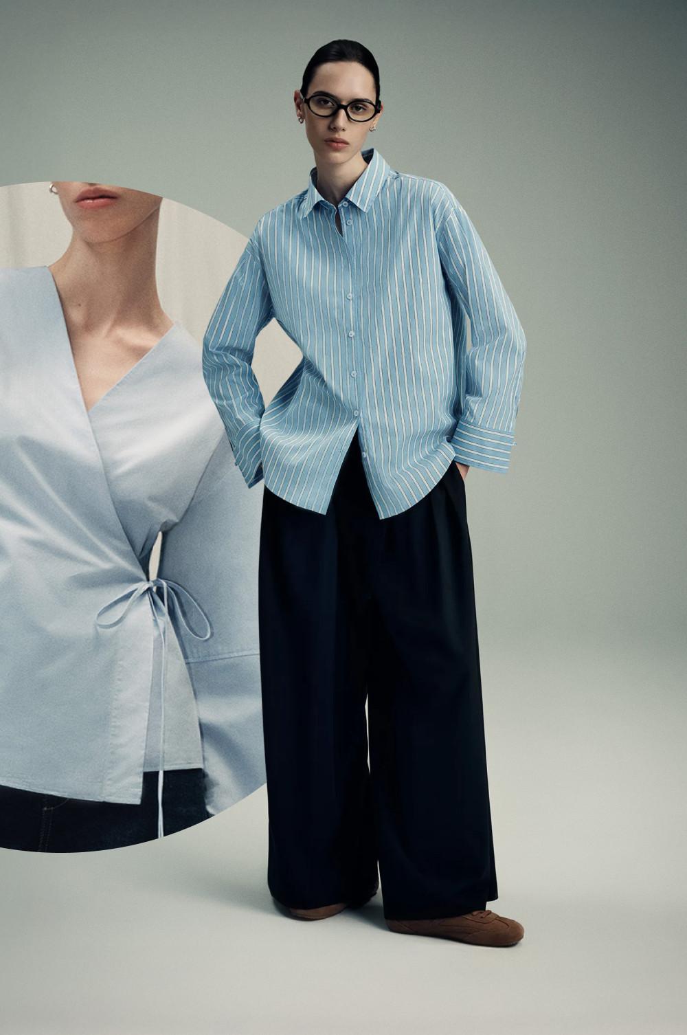 Persona con camisa azul a rayas con botones, pantalón azul marino de pernera ancha y zapatos marrones. Editorial de moda y estilismo.