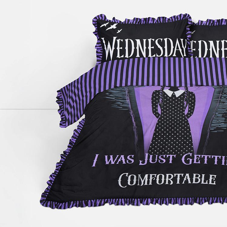 Gothic-style bedding with purple and black stripes featuring Wednesday-themed text and dress design.