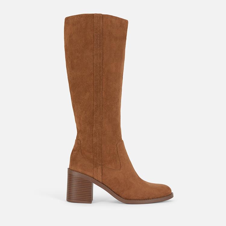 Tan suede knee-high boot with wooden block heel and stitched side panel detail.