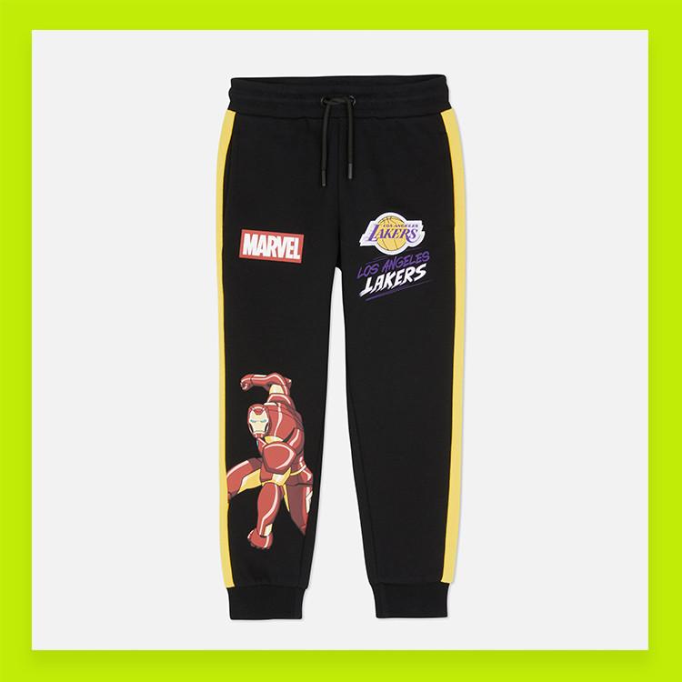 Black joggers with Marvel and LA Lakers logos, featuring Iron Man graphic and yellow side stripes.
