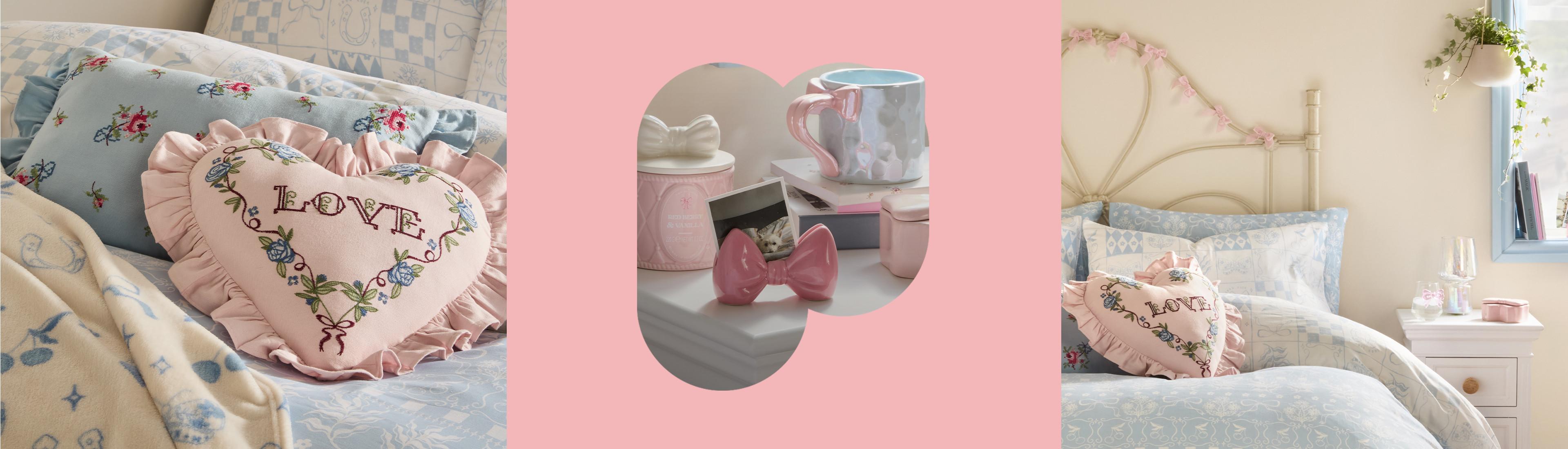 Coleção com almofada em forma de coração cor-de-rosa com bordado “LOVE”, caneca cerâmica cor-de-rosa e decoração de quarto em tons pastel.