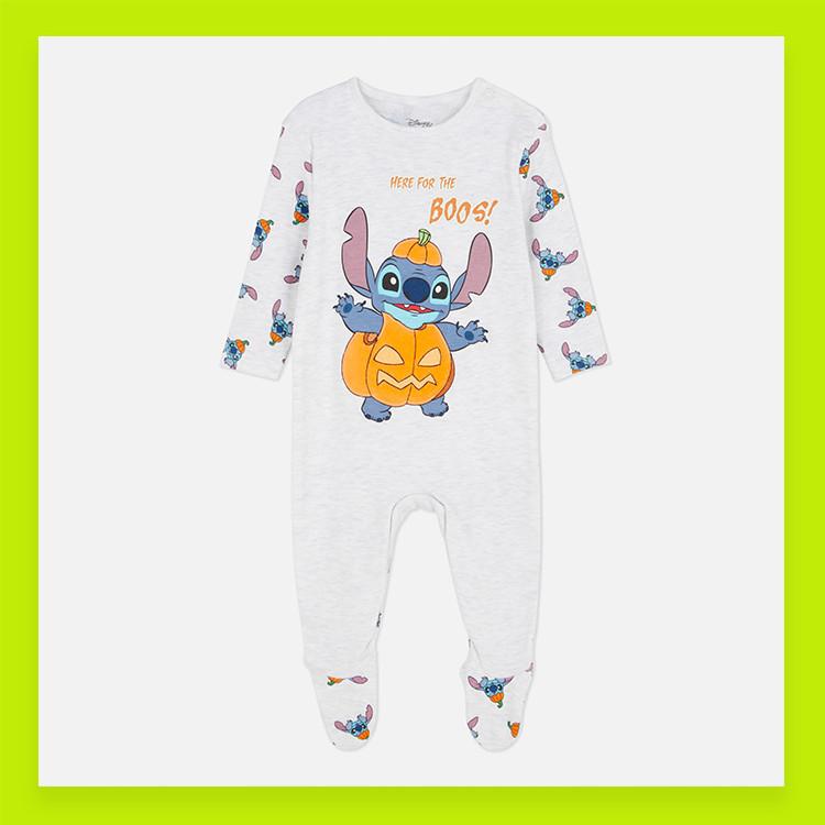 White Disney Stitch Halloween baby sleepsuit featuring Stitch in a pumpkin with "HERE FOR THE BOOS!" text.