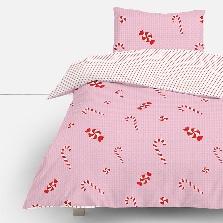 Pink bedding set with candy cane and sweet pattern, featuring striped reverse side and matching pillowcase.