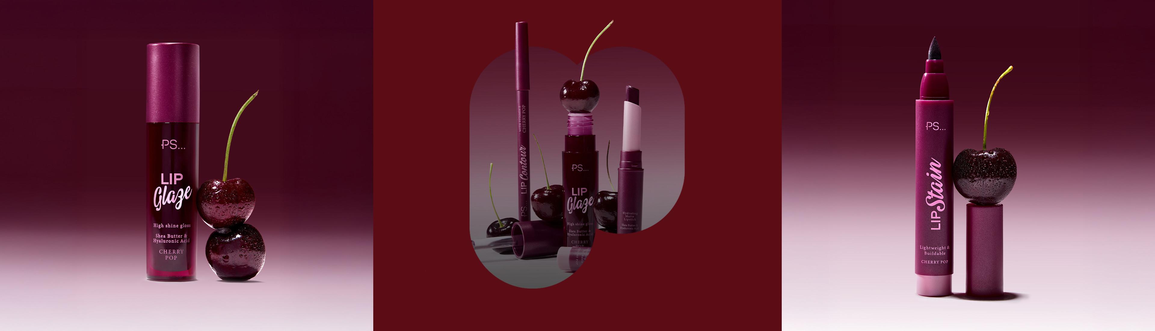 PS... Cherry Pop lip products in burgundy packaging displayed with decorative cherries against a dark red background.