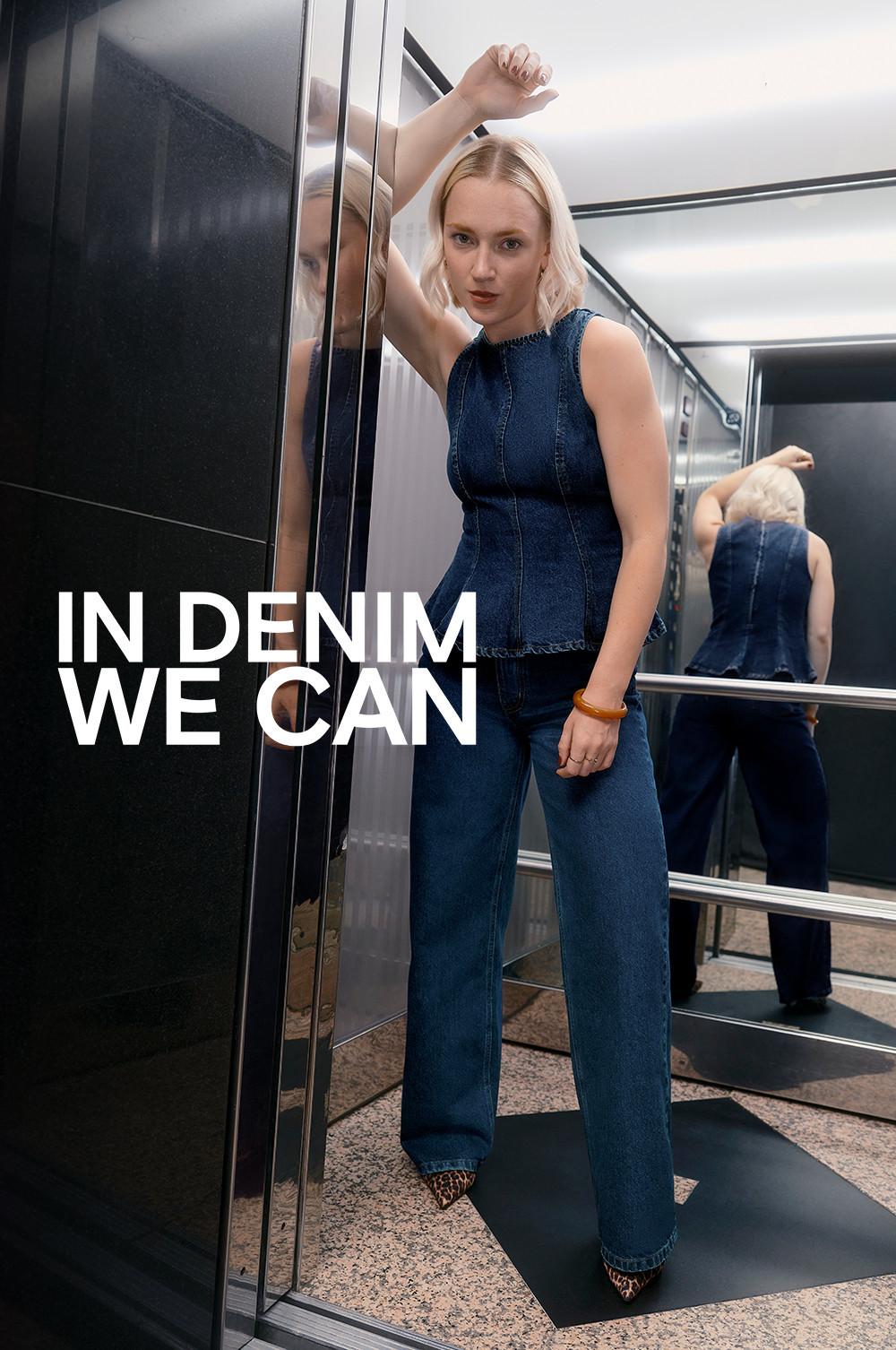 Person wearing denim peplum top and jeans with leopard print shoes in an elevator.